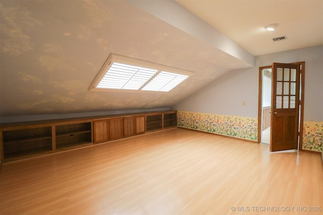 9337 S Lakewood Ave, Tulsa, OK 74137 - additional living space with light wood-style flooring and lofted ceiling