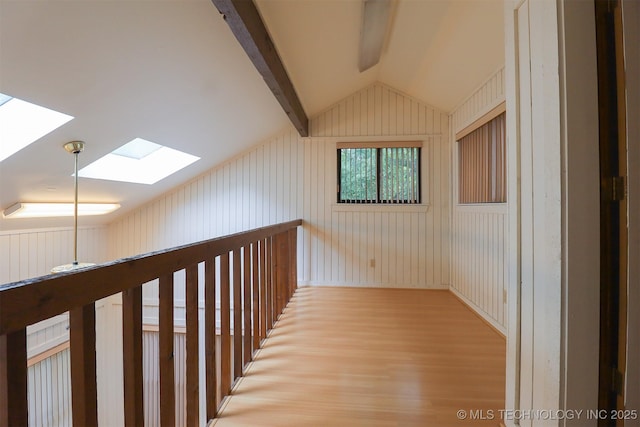 9337 S Lakewood Ave, Tulsa, OK 74137 - corridor featuring a skylight, vaulted ceiling, and light wood-style floors