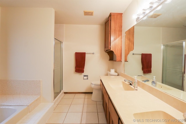 9337 S Lakewood Ave, Tulsa, OK 74137 - bathroom featuring a stall shower, double vanity, a bath, tile patterned floors, and toilet