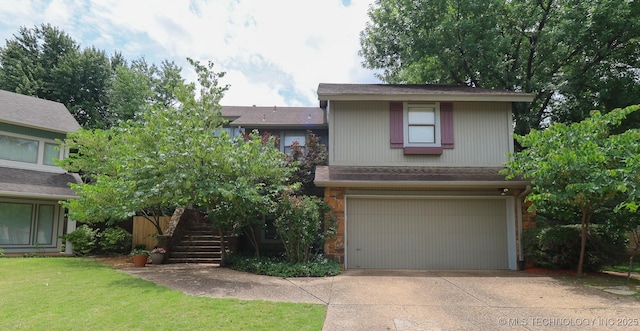 9337 S Lakewood Ave, Tulsa, OK 74137 - view of front facade featuring an attached garage, driveway, stairway, and a front yard