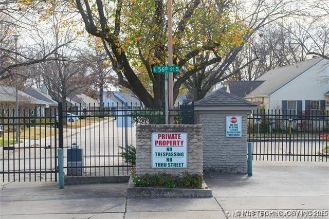 5614 S Newport Ave Unit 5614, Tulsa, OK 74105 - gate featuring a residential view