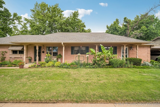 5614 S Newport Ave Unit 5614, Tulsa, OK 74105 - ranch-style house with brick siding and a front lawn
