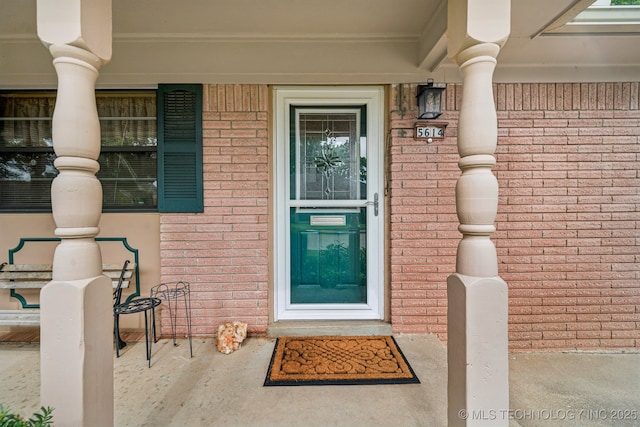 5614 S Newport Ave Unit 5614, Tulsa, OK 74105 - entrance to property with a porch and brick siding