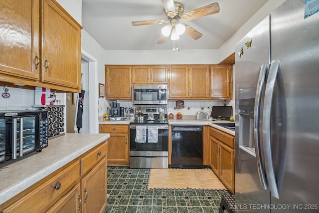5614 S Newport Ave Unit 5614, Tulsa, OK 74105 - kitchen featuring appliances with stainless steel finishes, light countertops, tasteful backsplash, dark floors, and a ceiling fan