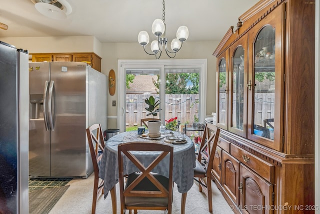 5614 S Newport Ave Unit 5614, Tulsa, OK 74105 - dining area with light carpet and a chandelier