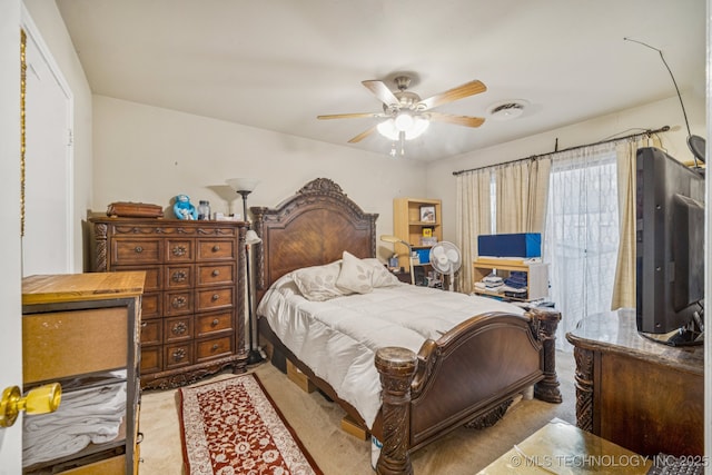 5614 S Newport Ave Unit 5614, Tulsa, OK 74105 - bedroom featuring a ceiling fan and carpet flooring