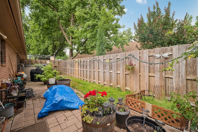 5614 S Newport Ave Unit 5614, Tulsa, OK 74105 - fenced backyard with a patio