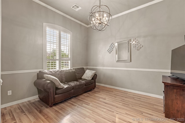 5006 S 164th E Ave, Tulsa, OK 74134 - living room featuring wood finished floors, a chandelier, crown molding, and baseboards