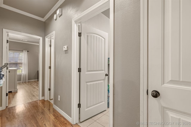 5006 S 164th E Ave, Tulsa, OK 74134 - hallway with crown molding, light wood finished floors, and baseboards