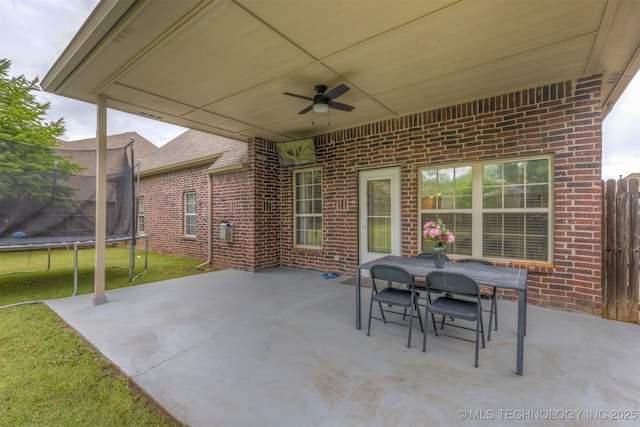 5006 S 164th E Ave, Tulsa, OK 74134 - view of patio featuring a trampoline, ceiling fan, and outdoor dining area