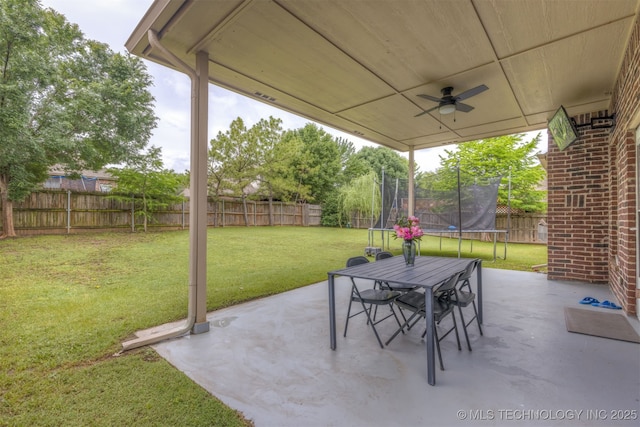 5006 S 164th E Ave, Tulsa, OK 74134 - view of patio / terrace with a trampoline, a ceiling fan, and outdoor dining area