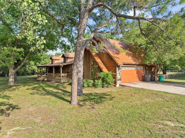 3419 State Highway 199, Dickson, OK 73401 - view of front of property with covered porch, a front yard, an attached garage, driveway, and a metal roof
