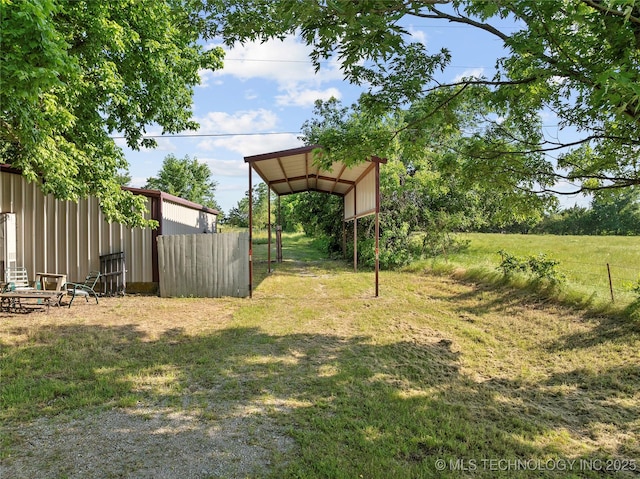 3419 State Highway 199, Dickson, OK 73401 - view of yard with a detached carport and an outbuilding