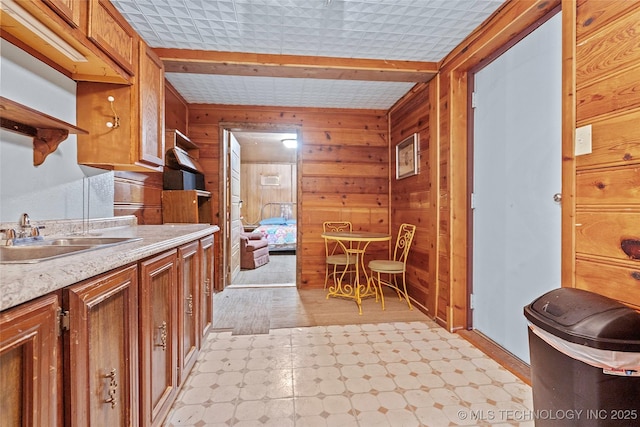 3419 State Highway 199, Dickson, OK 73401 - bathroom with wooden walls, tile patterned floors, and vanity