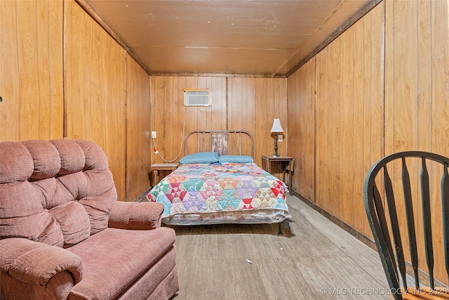 3419 State Highway 199, Dickson, OK 73401 - bedroom featuring wooden walls, a wall unit AC, and wood finished floors