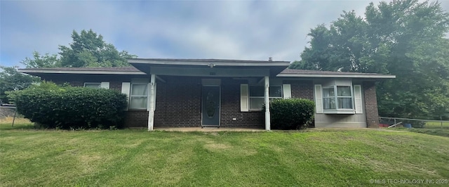 910 Race St, Boswell, OK 74727 - rear view of property with brick siding and a yard