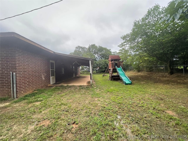 910 Race St, Boswell, OK 74727 - view of yard featuring a playground and a patio area