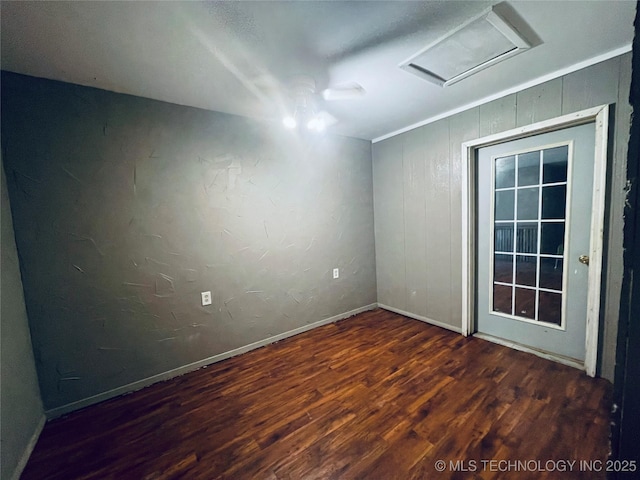910 Race St, Boswell, OK 74727 - unfurnished room featuring wood finished floors, attic access, and baseboards