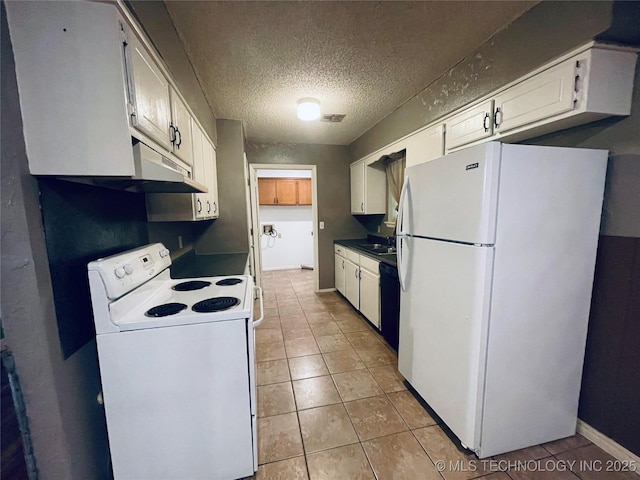 910 Race St, Boswell, OK 74727 - kitchen featuring white appliances, a sink, light tile patterned floors, white cabinetry, and a textured ceiling