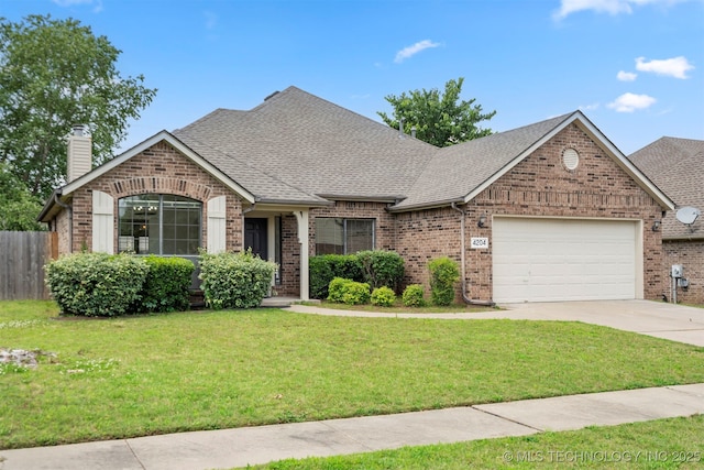 4204 W Freeport St, Broken Arrow, OK 74012 - french country home with brick siding, an attached garage, concrete driveway, and a chimney