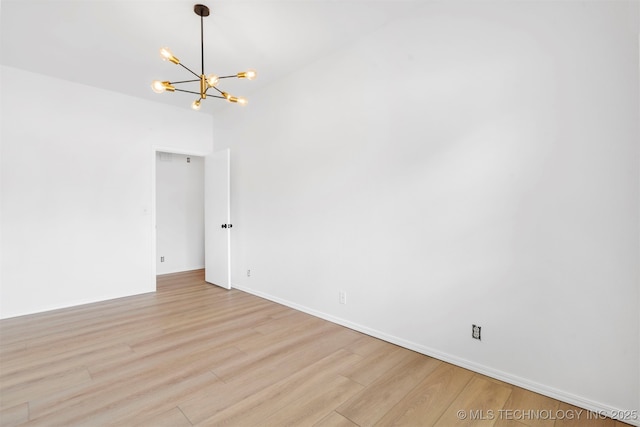 4204 W Freeport St, Broken Arrow, OK 74012 - unfurnished room featuring a chandelier, light wood-style floors, and baseboards