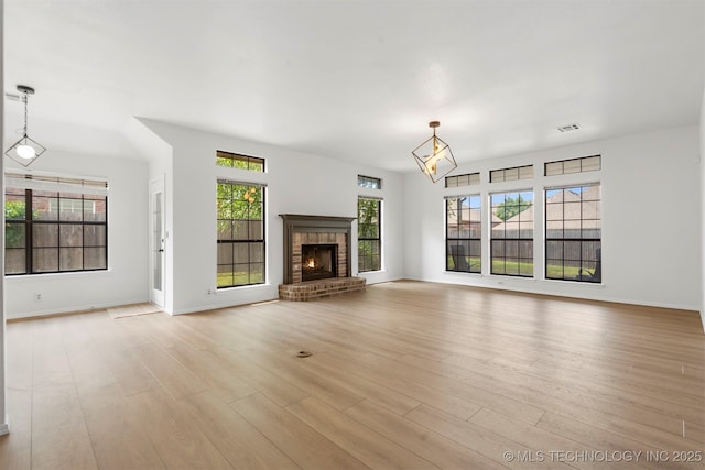 4204 W Freeport St, Broken Arrow, OK 74012 - unfurnished living room with wood finished floors, a fireplace, and baseboards