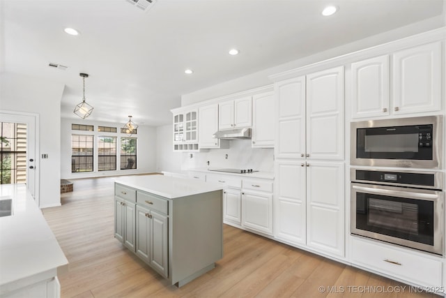 4204 W Freeport St, Broken Arrow, OK 74012 - kitchen featuring oven, gray cabinetry, built in microwave, white cabinetry, and light wood-style flooring