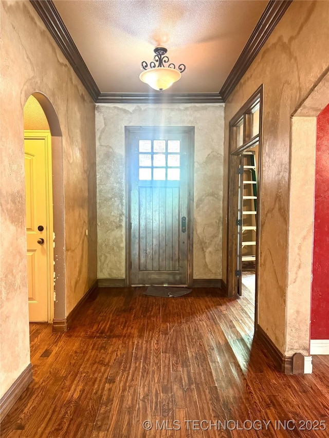 2508 E 140th Pl S, Jenks, OK 74008 - entrance foyer featuring hardwood / wood-style flooring, ornamental molding, arched walkways, baseboards, and a textured ceiling