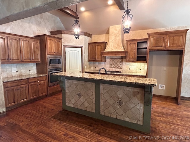 2508 E 140th Pl S, Jenks, OK 74008 - kitchen with appliances with stainless steel finishes, premium range hood, backsplash, light stone counters, and dark wood-type flooring