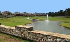 2508 E 140th Pl S, Jenks, OK 74008 - surrounding community with a water view and a yard