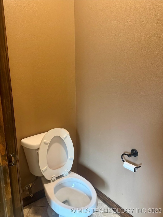 2508 E 140th Pl S, Jenks, OK 74008 - bathroom featuring toilet, tile patterned flooring, and baseboards