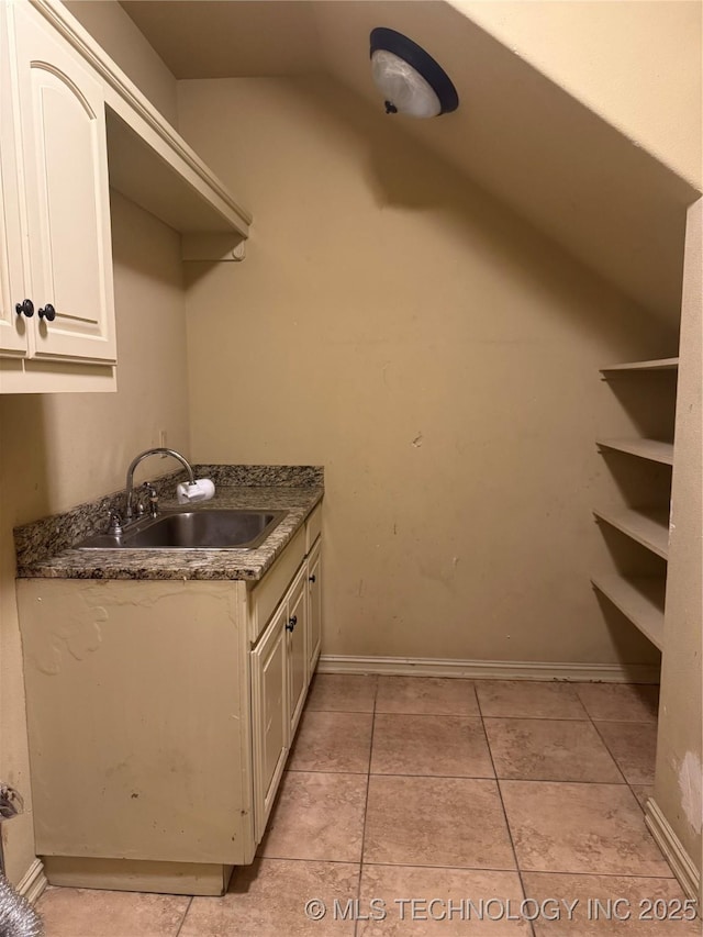 2508 E 140th Pl S, Jenks, OK 74008 - laundry area featuring a sink, light tile patterned floors, and baseboards