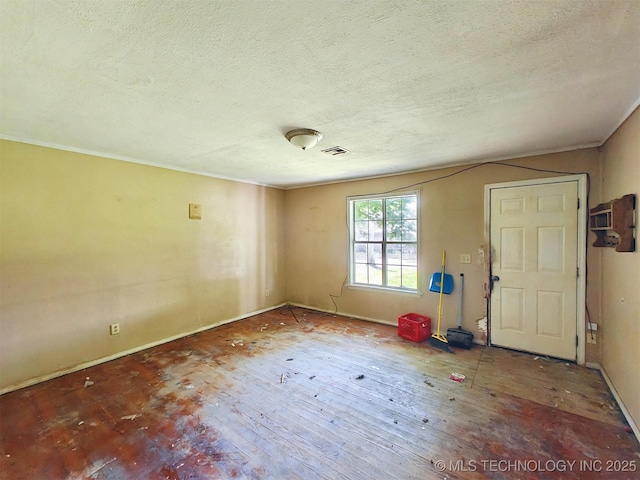 619 E Cherrie St, Tahlequah, OK 74464 - entryway featuring a textured ceiling and baseboards