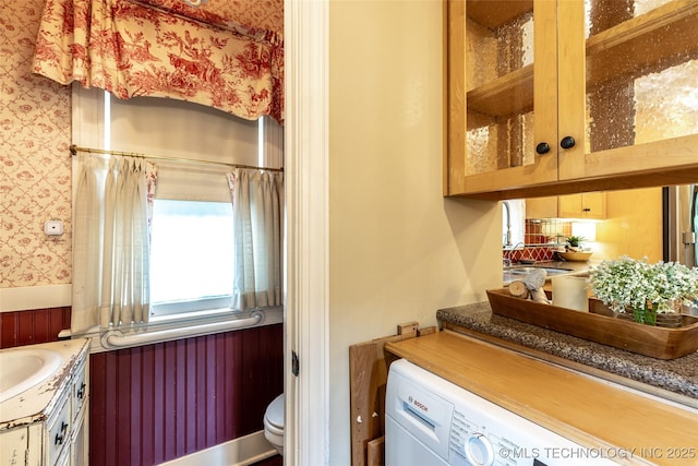 3160 S Owasso Ave, Tulsa, OK 74105 - bathroom with washer / clothes dryer, wallpapered walls, vanity, and toilet