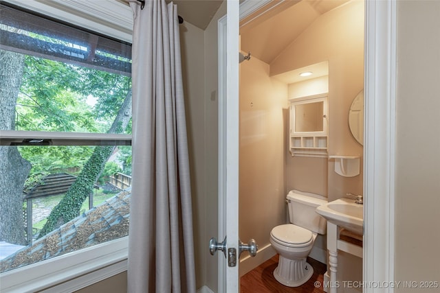 3160 S Owasso Ave, Tulsa, OK 74105 - half bathroom with toilet, lofted ceiling, wood finished floors, a sink, and baseboards