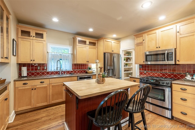 3160 S Owasso Ave, Tulsa, OK 74105 - kitchen featuring appliances with stainless steel finishes, a sink, light brown cabinets, butcher block counters, and recessed lighting