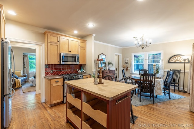 3160 S Owasso Ave, Tulsa, OK 74105 - kitchen featuring stainless steel appliances, wood counters, light brown cabinets, light wood finished floors, and plenty of natural light