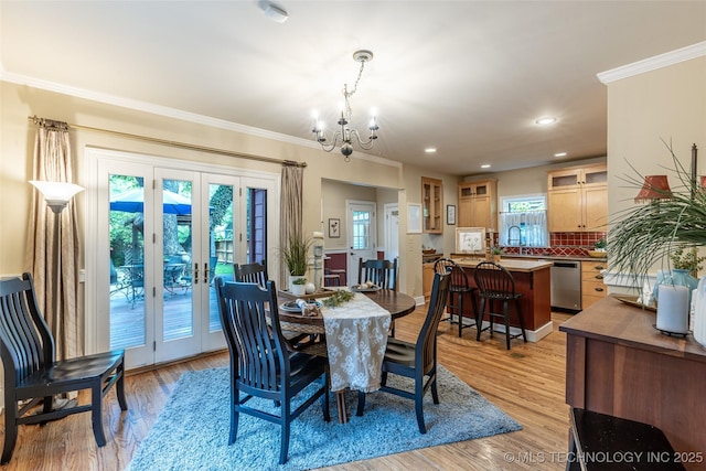 3160 S Owasso Ave, Tulsa, OK 74105 - dining area featuring a chandelier, french doors, crown molding, light wood-style flooring, and recessed lighting