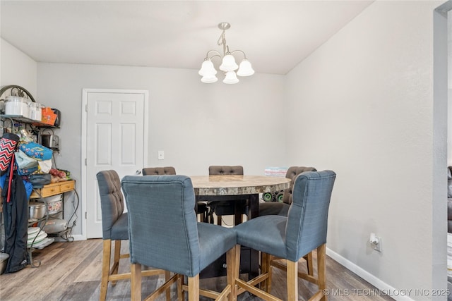 4316 S Ash Ave, Broken Arrow, OK 74011 - dining space featuring a chandelier, wood finished floors, and baseboards