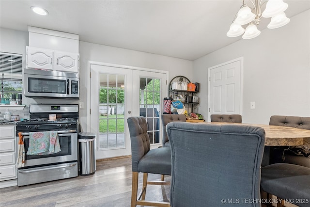 4316 S Ash Ave, Broken Arrow, OK 74011 - dining area featuring a chandelier, wood finished floors, french doors, and recessed lighting