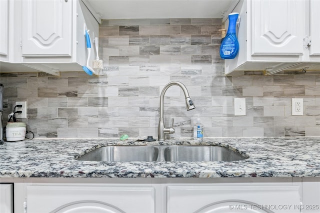 4316 S Ash Ave, Broken Arrow, OK 74011 - kitchen featuring tasteful backsplash, a sink, white cabinets, and light stone counters