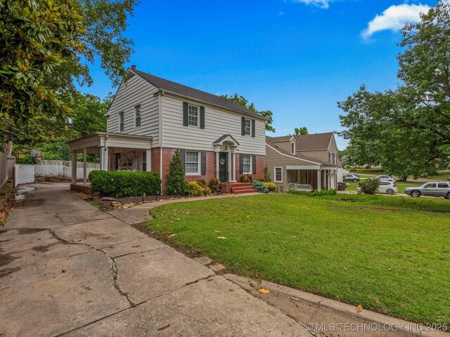 1629 Dewey Ave, Bartlesville, OK 74003 - view of front of house featuring brick siding and driveway