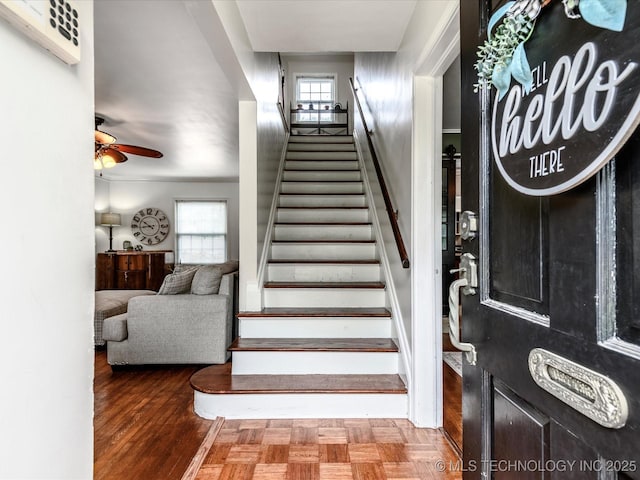 1629 Dewey Ave, Bartlesville, OK 74003 - stairway with healthy amount of natural light and a ceiling fan