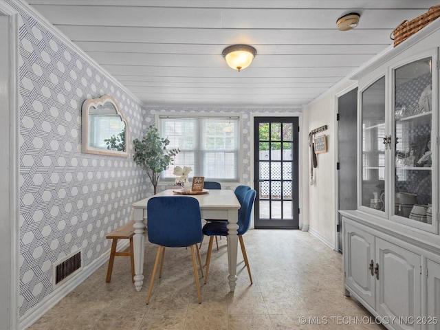 1629 Dewey Ave, Bartlesville, OK 74003 - dining room with wallpapered walls and baseboards