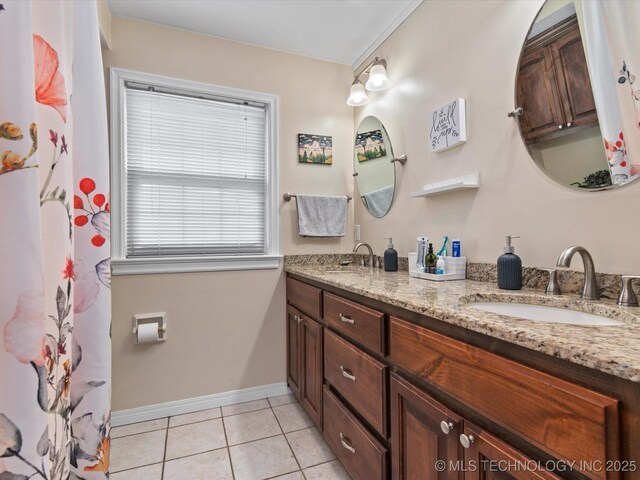 1629 Dewey Ave, Bartlesville, OK 74003 - full bath featuring double vanity, baseboards, and tile patterned floors
