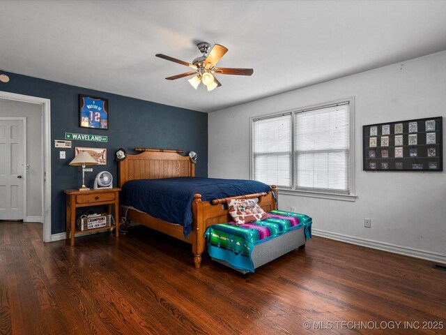 1629 Dewey Ave, Bartlesville, OK 74003 - bedroom featuring wood finished floors, baseboards, and ceiling fan