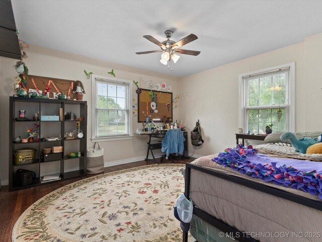 1629 Dewey Ave, Bartlesville, OK 74003 - bedroom featuring wood finished floors, ceiling fan, and baseboards