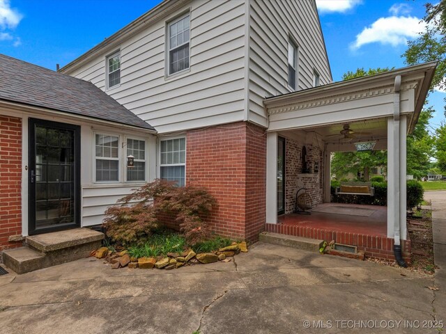 1629 Dewey Ave, Bartlesville, OK 74003 - entrance to property featuring brick siding and ceiling fan
