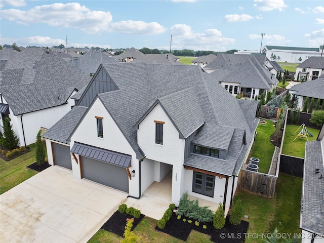 4607 S Retana Pl, Broken Arrow, OK 74011 - view of front facade with board and batten siding, a residential view, driveway, and a shingled roof