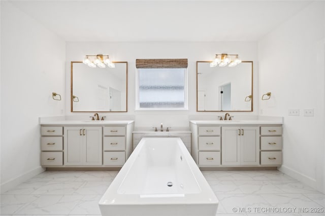 4607 S Retana Pl, Broken Arrow, OK 74011 - full bathroom featuring marble look tile flooring, a soaking tub, and two vanities